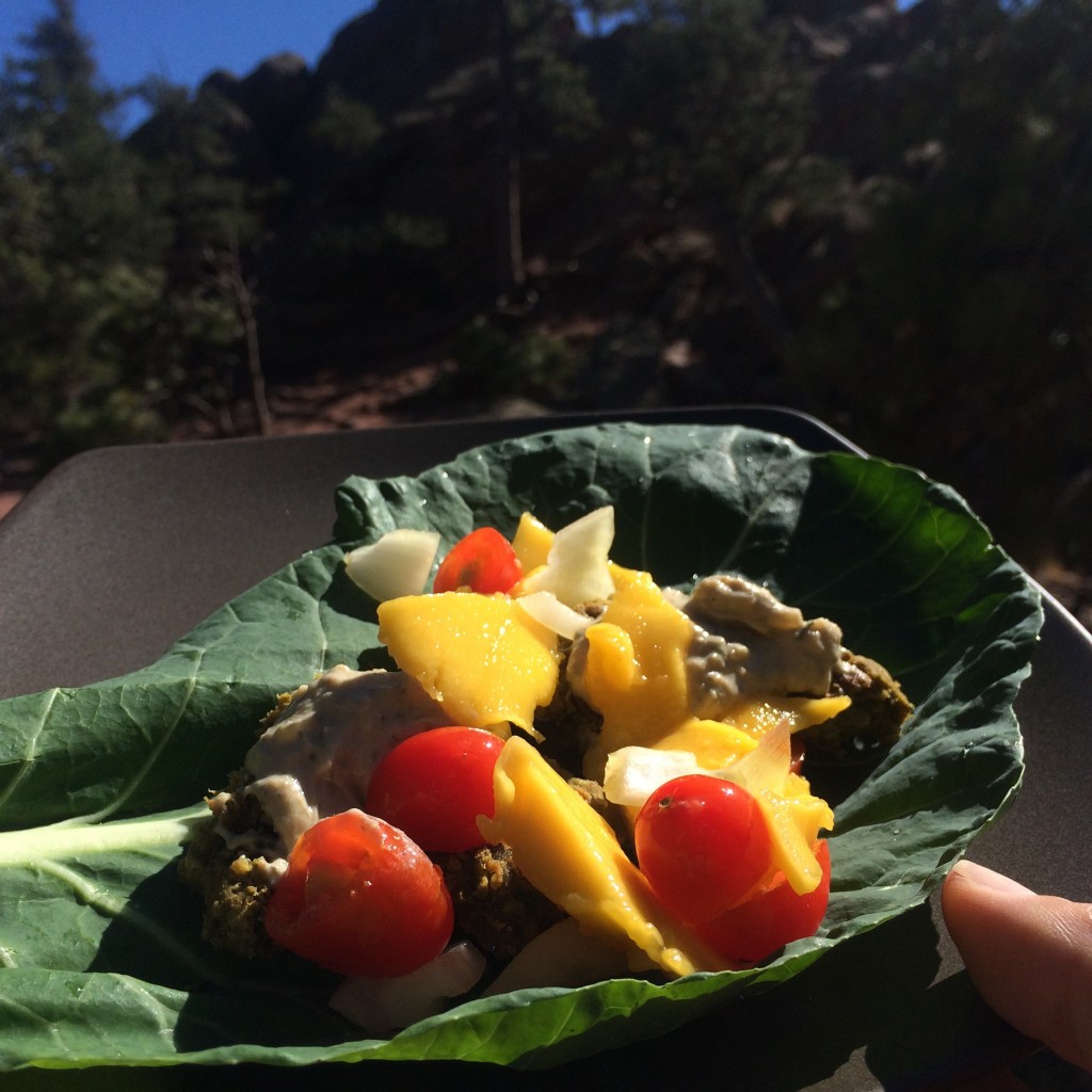Mango with cherry tomatoes and a Tahini-dill sauce with homemade falafels on a collard green leaf/wrap